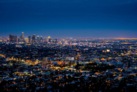 The Los Angeles skyline at night with the buildings lit up