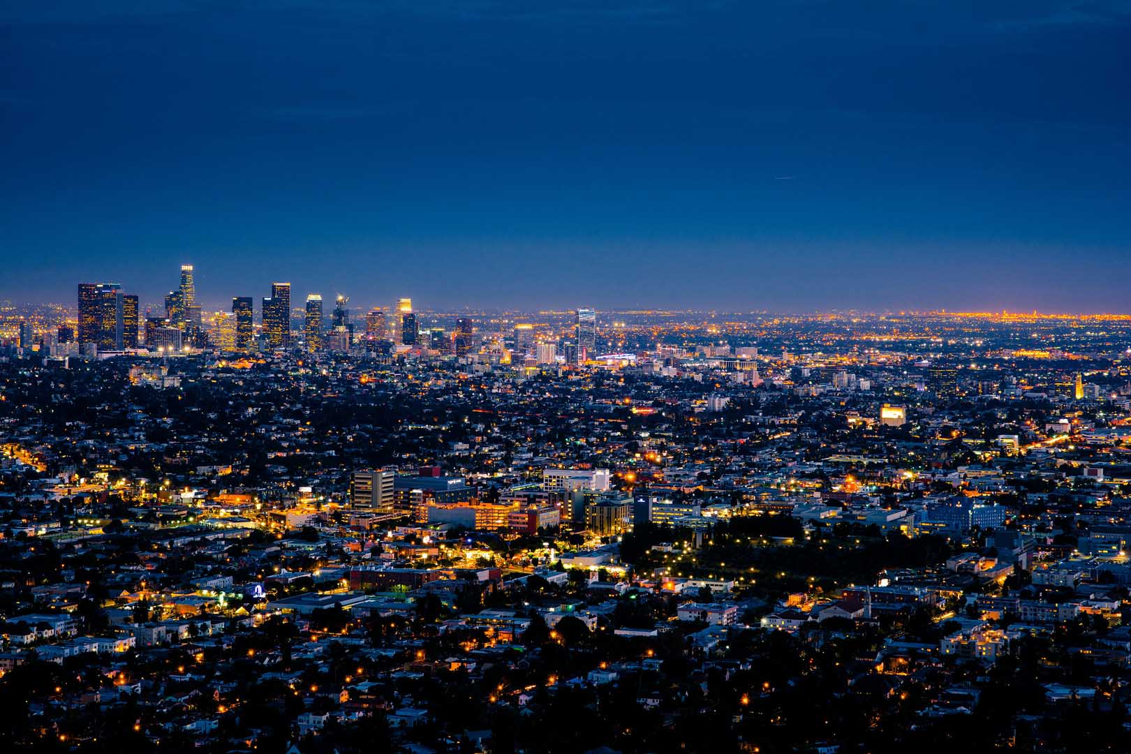 The Los Angeles skyline at night with the buildings lit up